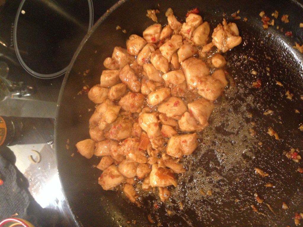 Chicken frying in spices