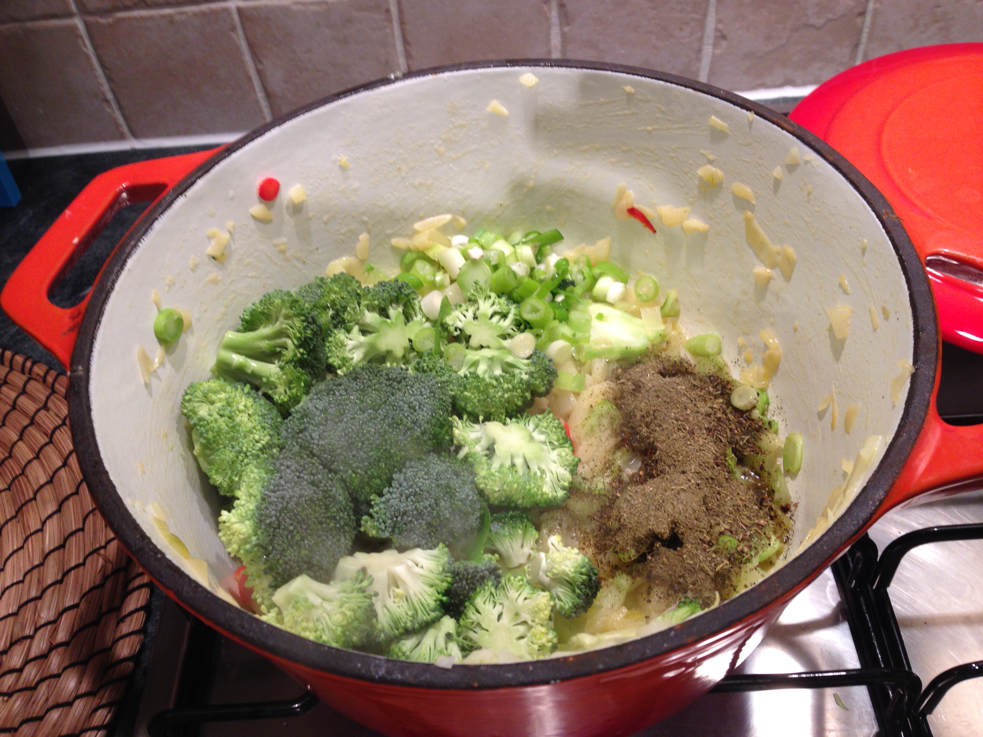 adding-broccoli-and-thyme-to-pot