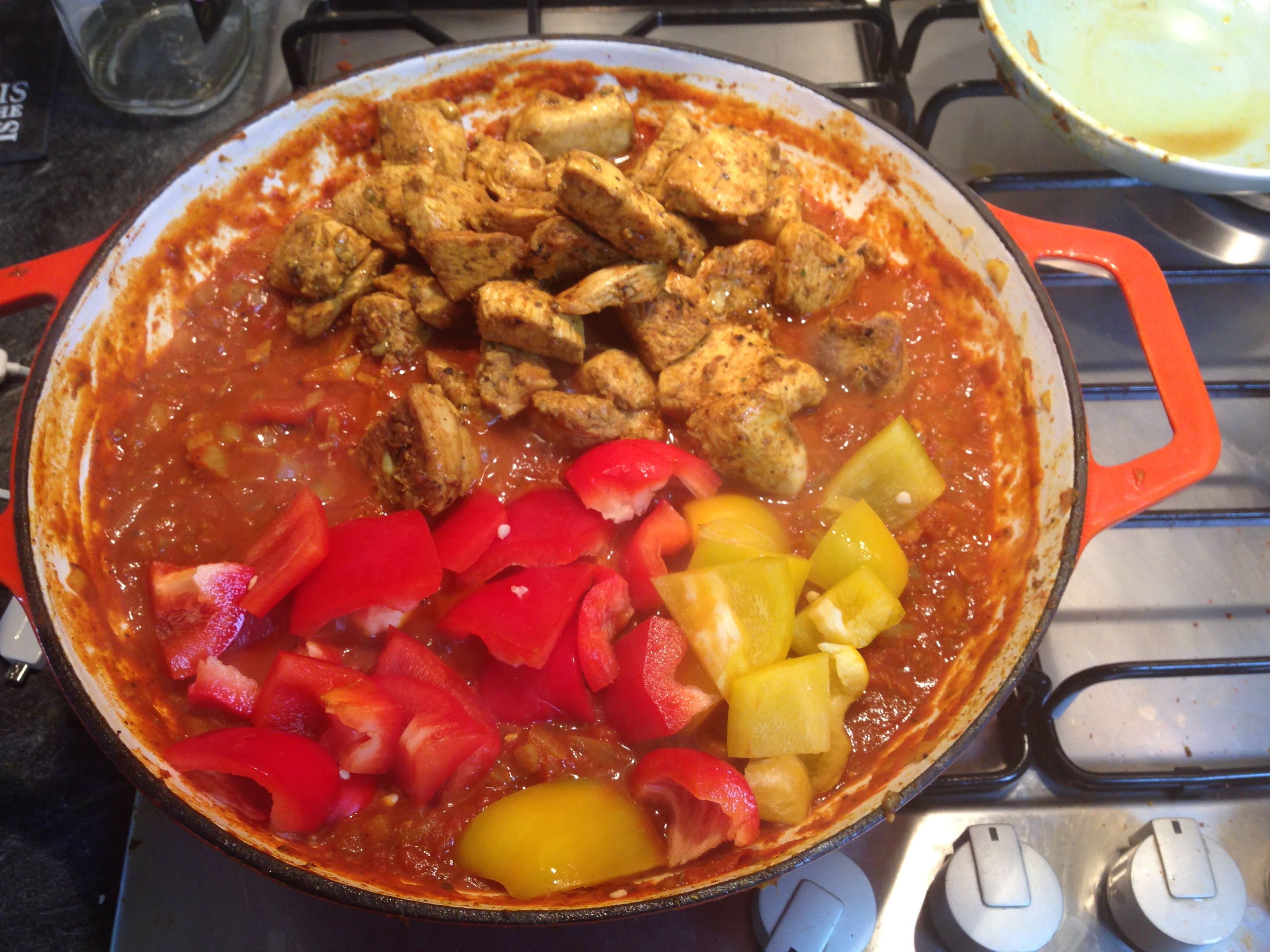 adding-chicken-and-pepper-curry